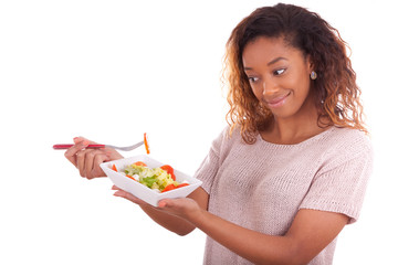 Wall Mural - African American woman eating salad, isolated on white backgroun