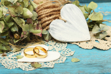 Sticker - pair of wedding rings on old style background