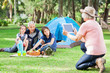 © Tyler Olson - Grandmother Photographing Family At Campsite