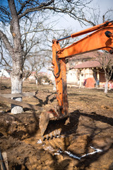 Wall Mural - track-type loader excavator digging and leveling earth