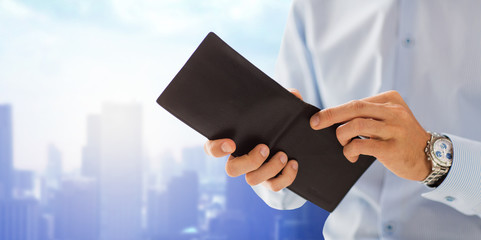 Canvas Print - close up of businessman hands holding open wallet