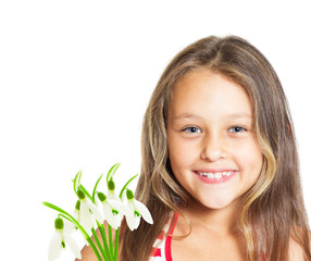 Wall Mural - portrait of cute little girl with a bouquet of snowdrops