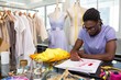 Attractive african american male fashion designer sketching