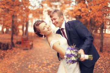 Wall Mural - bride and groom in autumn park Love Life