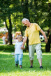 © .shock - grandfather and child have fun  in park