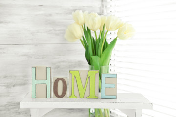 Sticker - Home in colorful letters and spring flowers in light white