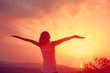 © lzf - cheering young woman enjoy the view at sunset mountain peak roc
