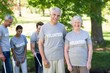 © WavebreakmediaMicro - Happy volunteer senior couple smiling at the camera