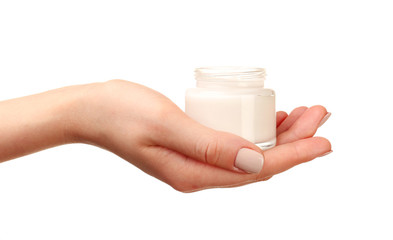 Female hand holding jar of cream isolated on white