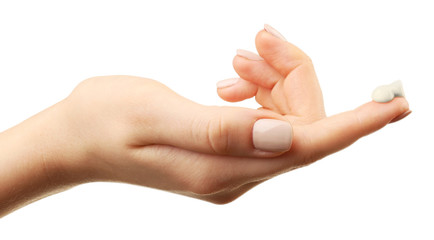 Wall Mural - Woman caring hand with cream isolated on white