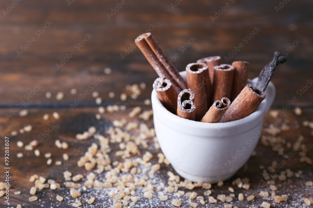 Cinnamon and vanilla sticks with sugar