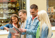 © Syda Productions - group of smiling friends with tablet pc computers