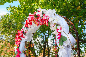 Wall Mural - wedding arch decorated with pink orchids