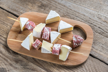 Wall Mural - camembert and salami skewers