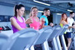 © .shock - Group of people running on treadmills