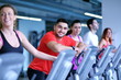 © .shock - Group of people running on treadmills
