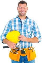 Poster - Smiling handyman holding hardhat and hammer