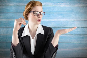 Poster - Businesswoman holding hand out in presentation