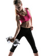 Young adult fitness woman doing swing exercise with a dumbbell
