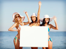 Girls With Blank Board On The Beach