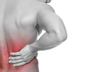 Young man holding his back in pain, isolated on white background