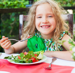 Sticker - Child eating salad at a cafe