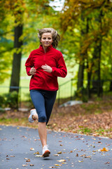 Wall Mural - Healthy lifestyle - woman running in park