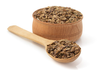 Canvas Print - dried dill seeds in bowl on white background