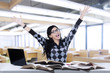 © Creativa Images - Excited student studying in class 1