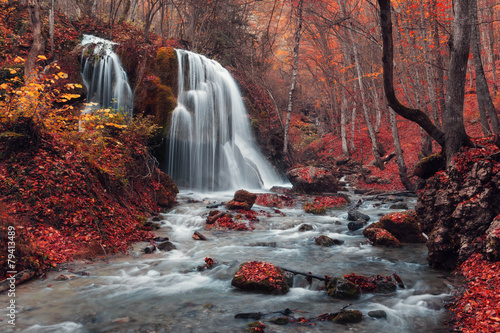 Plakat Beautiful waterfall in autumn forest