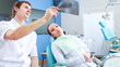 © shefkate - Young woman with dentist in a dental surgery. Healthcare