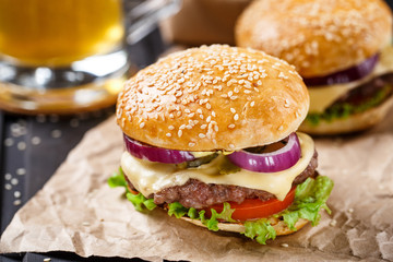 Delicious burger on wooden board