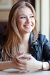© nuzza11 - young beautiful woman in cafe