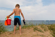 © Mikkel Bigandt - Young boy with plastic bucket