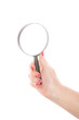 © guapofreak - Female hand holding magnifying glass on a white background
