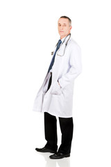 Wall Mural - Male doctor with hands in pockets