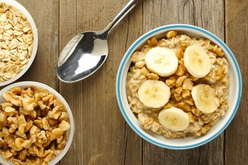Wall Mural - banana walnut overnight oatmeal in a bowl on wood table