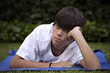 © fresnel6 - Teenager, with acne knocked down in the grass