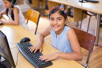 Cute pupil in computer class