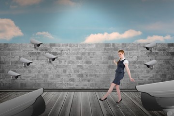 Poster - Composite image of businesswoman doing a balancing act