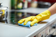 © Syda Productions - close up of woman cleaning cooker at home kitchen