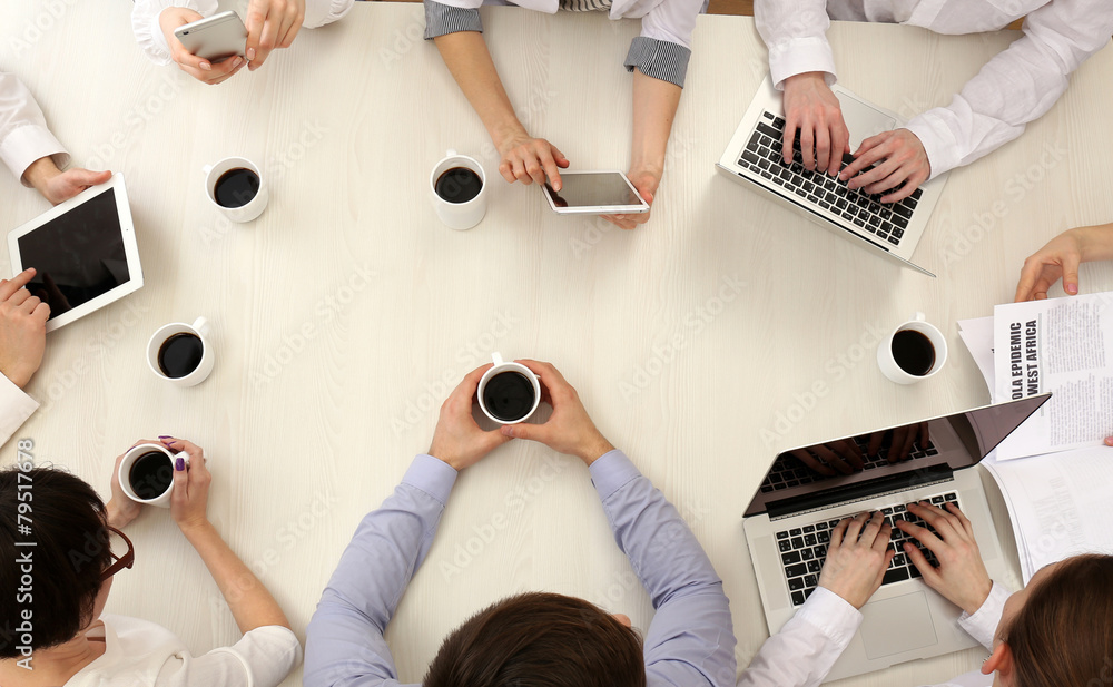 Group of business people working at desk top view