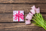 Fototapeta Tulipany - Gift box and bouquet of tulips