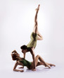 © Acronym - Couple of gymnasts in a studio
