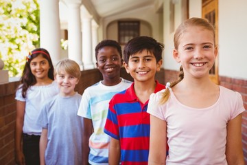 Poster - Smiling little school kids in school corridor