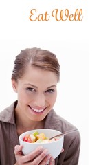 Eat well against smiling woman with bowl of fruit salad