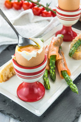 Canvas Print - Breakfast with egg, green asparagus and smocked salmon