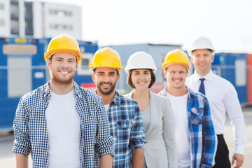 Sticker - group of smiling builders in hardhats outdoors