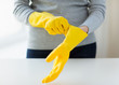 © Syda Productions - close up of woman wearing protective rubber gloves