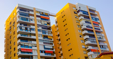 Modern Buildings With Balconies And Terraces In Yellow